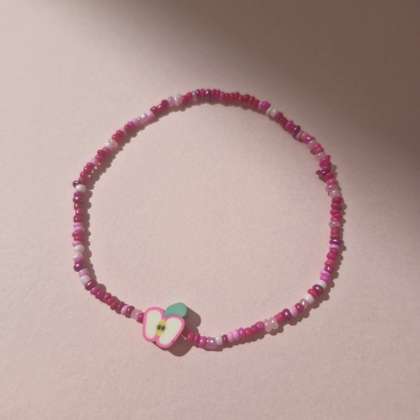 Pink Friendship Bracelet With A Apple Fruit