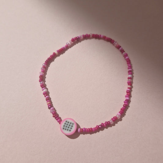 Pink Friendship Bracelet With A Dragon Fruit