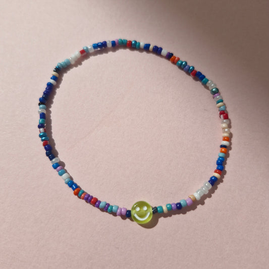 Multicoloured Friendship Bracelet With A Green Smiley Face