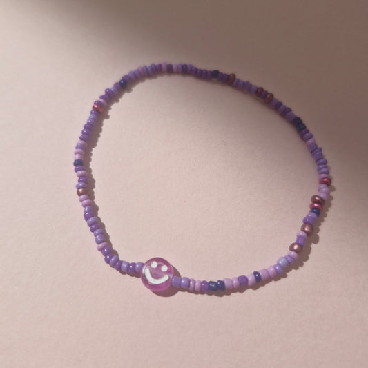 Purple Friendship Bracelet With A Purple Smiley Face