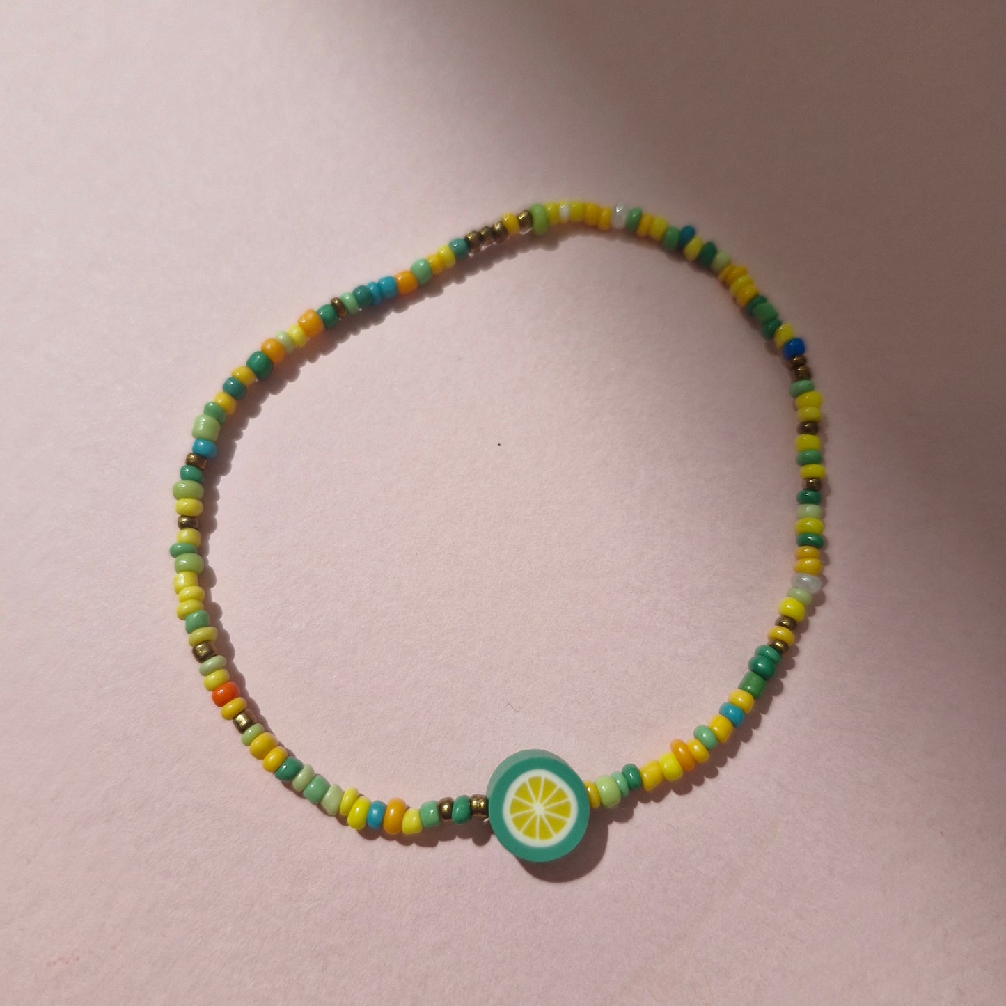 Green/Yellow Friendship Bracelet With A Green Fruit