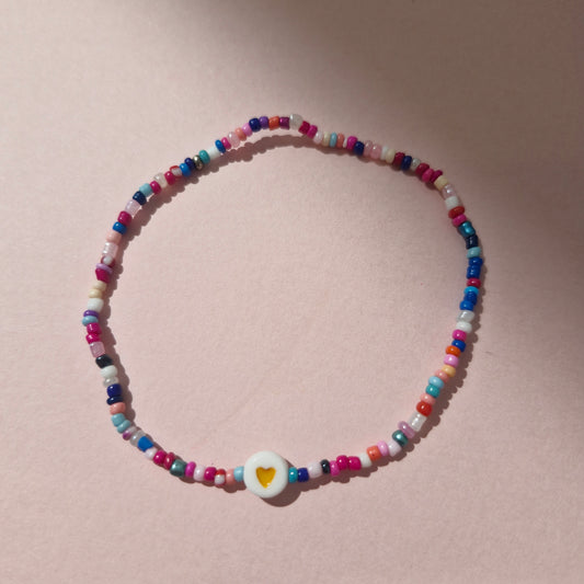 Multicoloured Friendship Bracelet With An Orange Heart