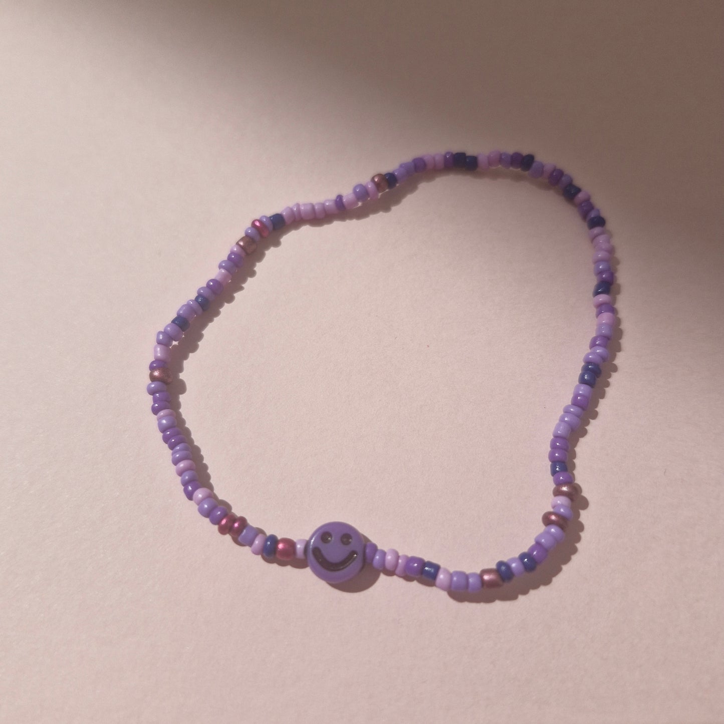 Purple Friendship Bracelet With A Purple Smiley Face