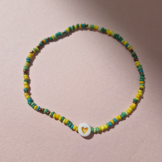 Green/Yellow Friendship Bracelet With An Orange Heart