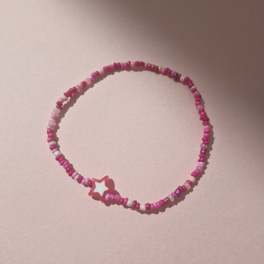 Pink Friendship Bracelet With A Pink Star