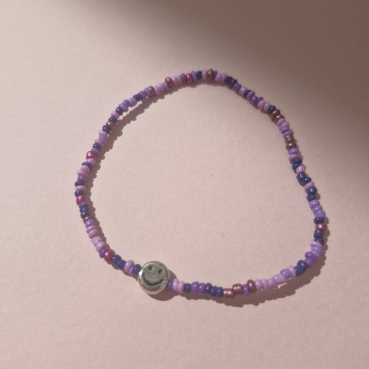 Purple Friendship Bracelet With A Silver Smiley Face