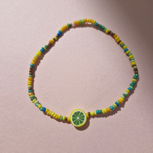 Green/Yellow Friendship Bracelet With A Yellow Fruit