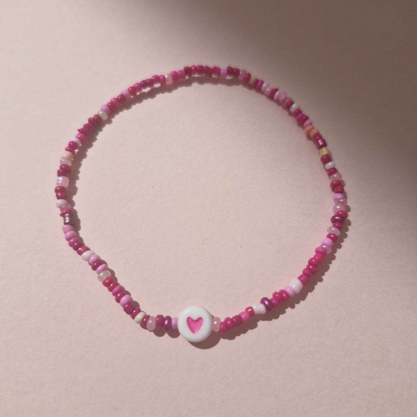 Pink Friendship Bracelet With A Pink Heart