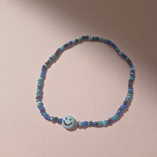 Blue Friendship Bracelet With A Blue Smiley Face