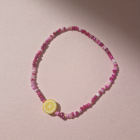 Pink Friendship Bracelet With A Lemon Fruit