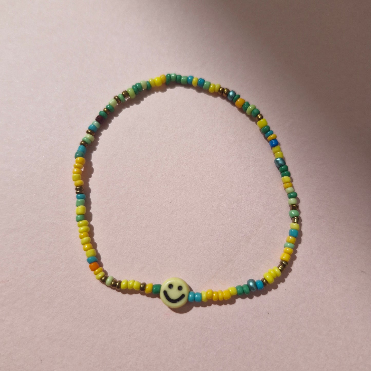 Green/Yellow Friendship Bracelet With A Yellow Smiley Face