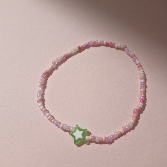 Light Pink Friendship Bracelet With A Green Star