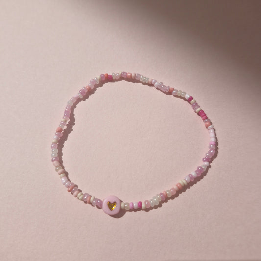 Light Pink Friendship Bracelet With A Pink & Gold Heart