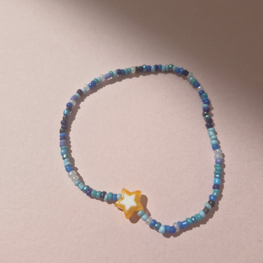 Blue Friendship Bracelet With An Orange Star