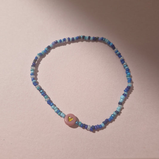 Blue Friendship Bracelet With A Pink & Gold Heart