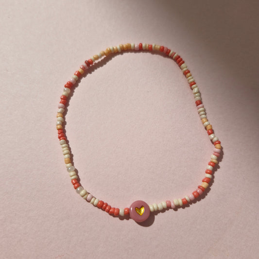 Coral/Peach Friendship Bracelet With A Pink & Gold Heart