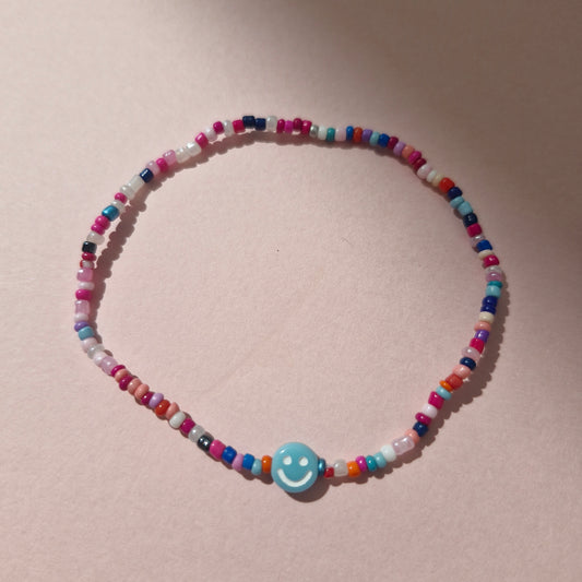 Multicoloured Friendship Bracelet With A Blue Smiley Face